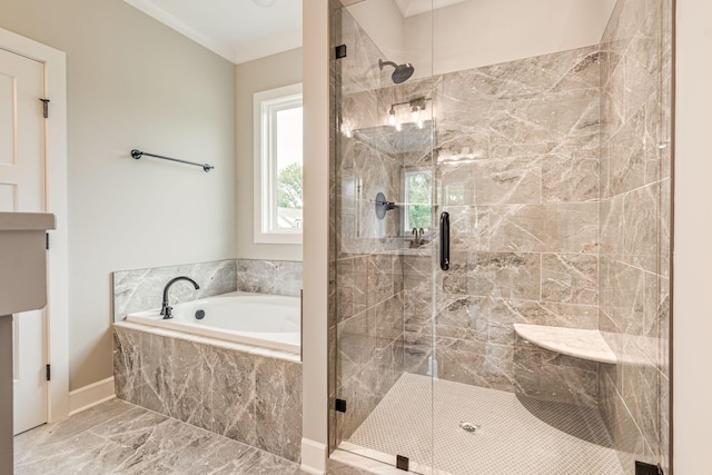 bathroom featuring shower with separate bathtub and ornamental molding