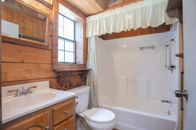 full bathroom featuring shower / bathing tub combination, vanity, toilet, and wooden walls