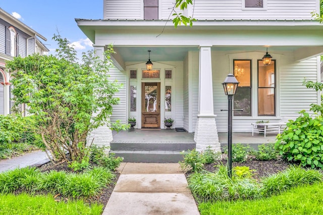 doorway to property featuring a porch