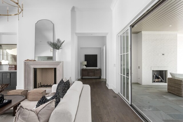 living room featuring dark hardwood / wood-style flooring and a fireplace