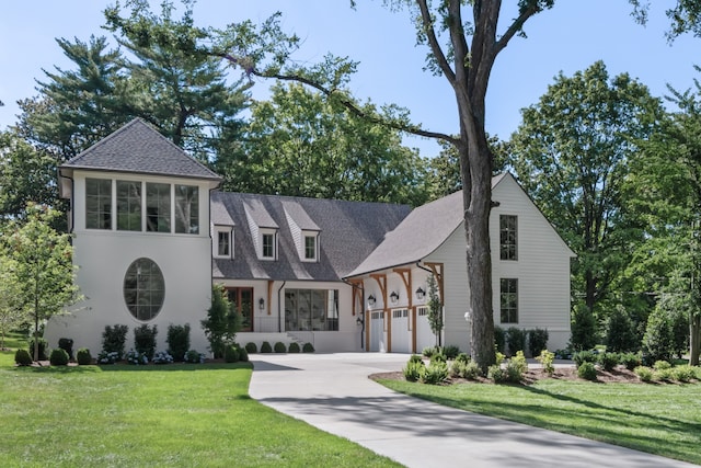 view of front facade with a front lawn and a garage