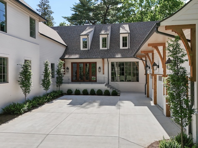 view of front facade featuring a patio area and french doors