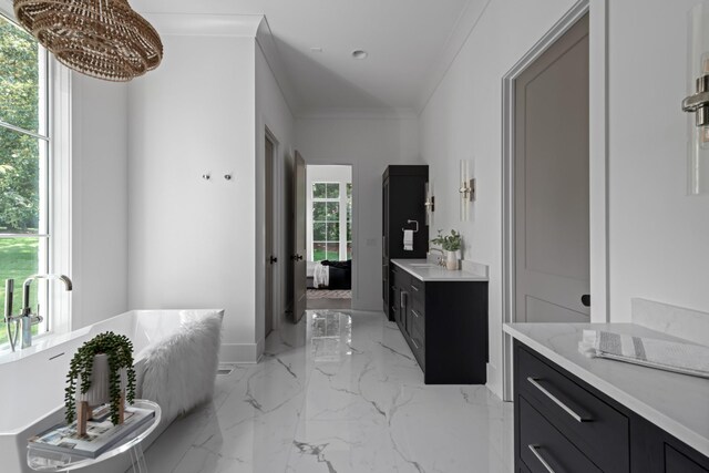 bathroom featuring tile floors, vanity, crown molding, and a chandelier