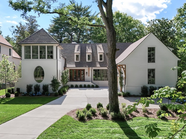 view of front of home featuring a front yard and french doors