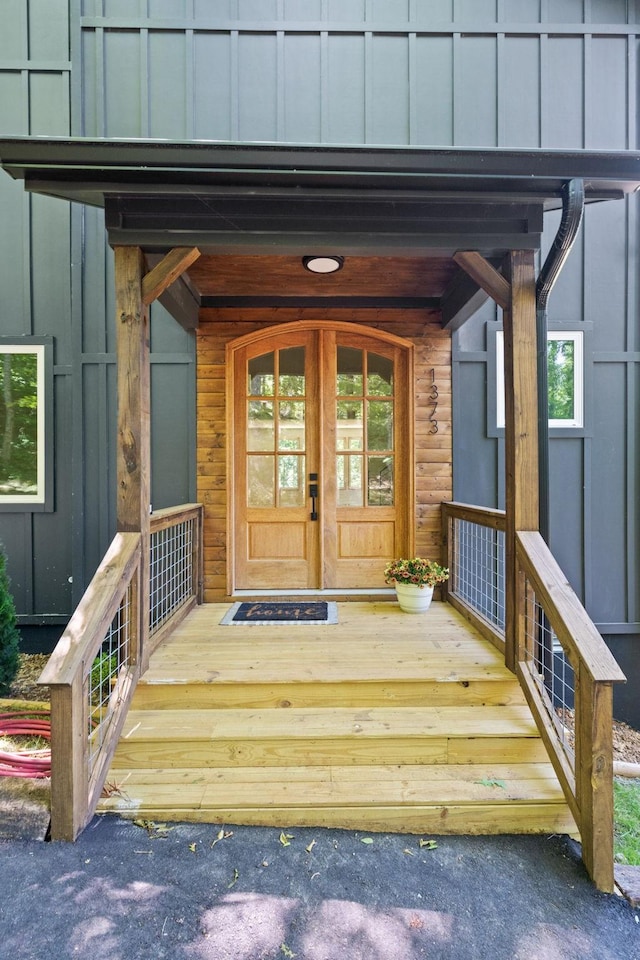 view of exterior entry with a porch