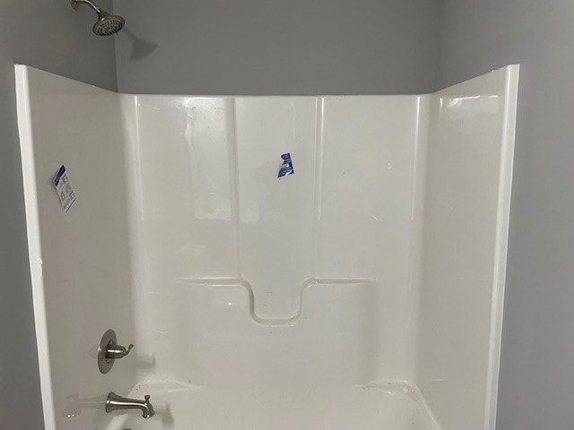 bathroom with shower / tub combination