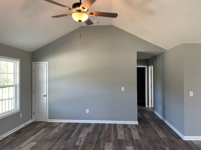 unfurnished room featuring ceiling fan, lofted ceiling, and dark hardwood / wood-style flooring