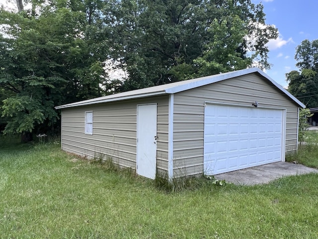 garage with a lawn