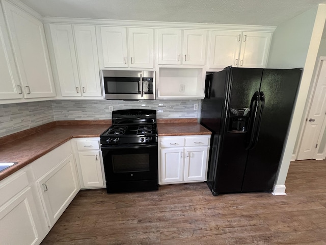 kitchen featuring white cabinetry, hardwood / wood-style floors, and black appliances