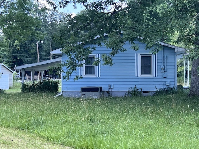 back of property with central AC