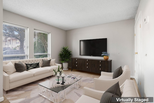 carpeted living room with a textured ceiling