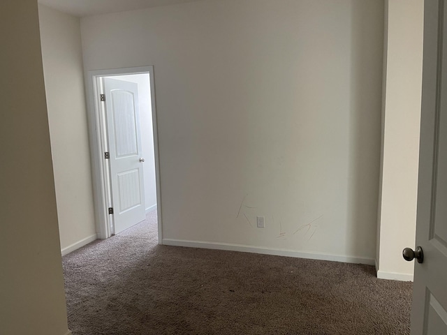 unfurnished room featuring carpet flooring