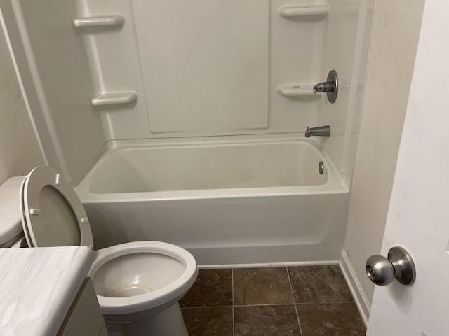 full bathroom featuring washtub / shower combination, vanity, and toilet