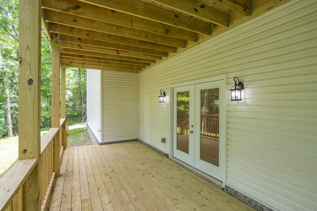 wooden deck featuring french doors