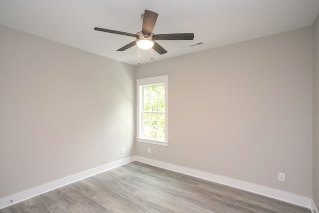 unfurnished room with ceiling fan and wood-type flooring