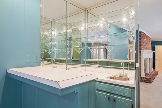 bathroom featuring a brick fireplace and sink