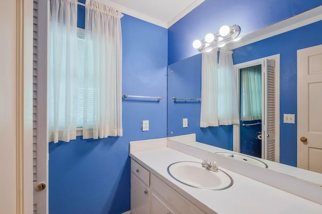 bathroom featuring vanity and ornamental molding