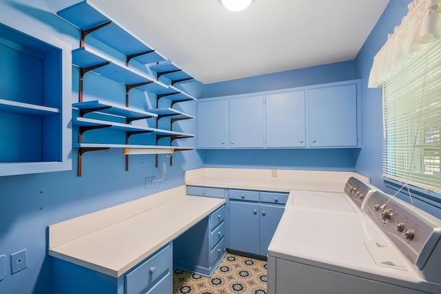 laundry area featuring cabinets and washer and clothes dryer