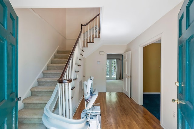 foyer with french doors and hardwood / wood-style flooring