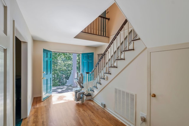 foyer entrance with hardwood / wood-style floors