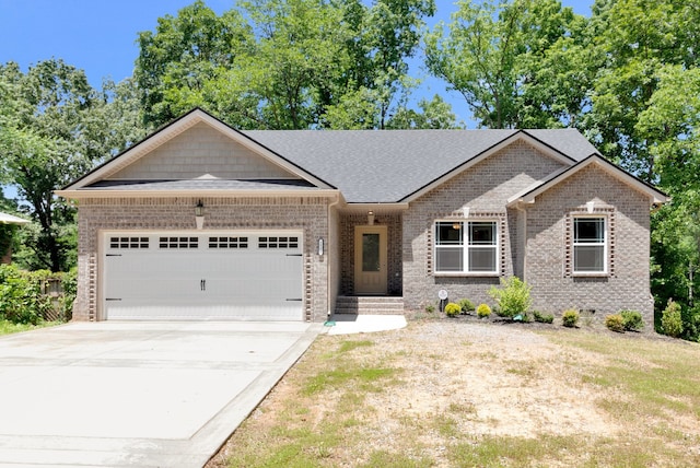 view of front facade featuring a garage and a front lawn