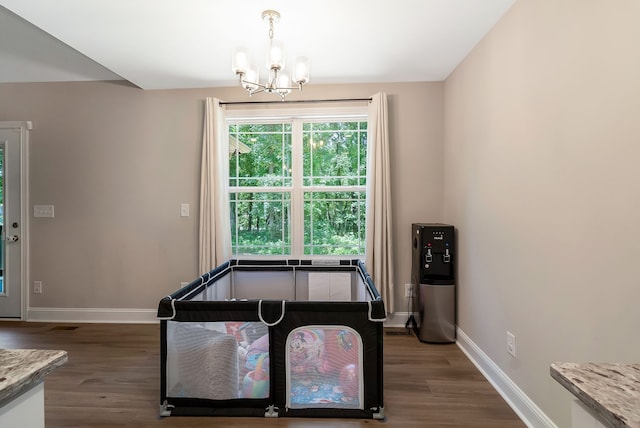 interior space with dark hardwood / wood-style floors and a chandelier