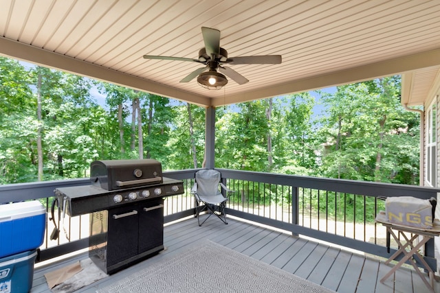 wooden terrace with ceiling fan and grilling area