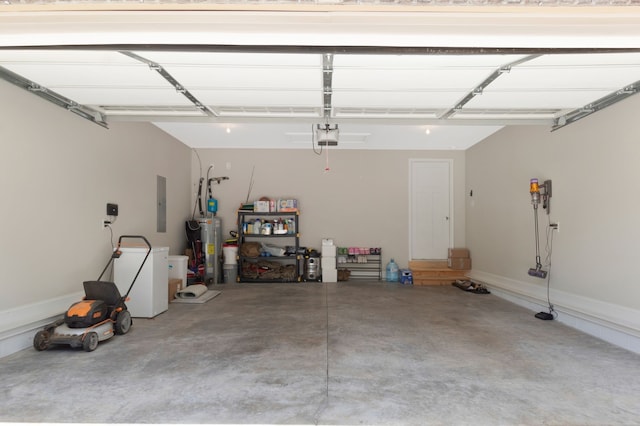 garage featuring a garage door opener, water heater, and fridge