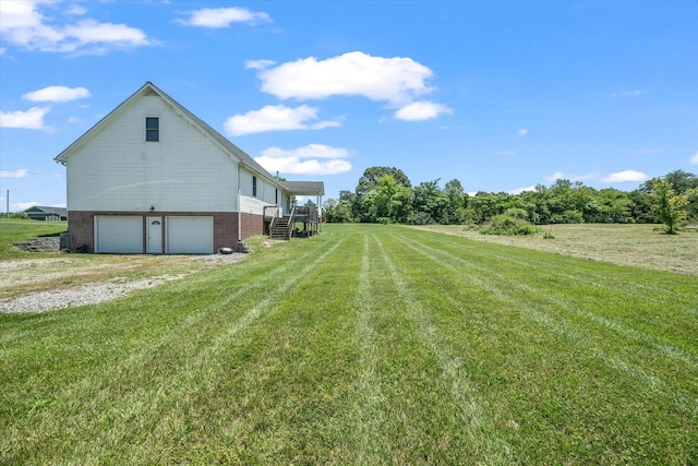 view of yard with a garage