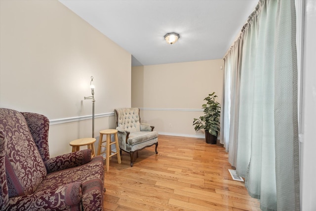 sitting room with light hardwood / wood-style flooring