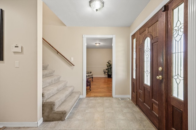 entryway with light hardwood / wood-style floors