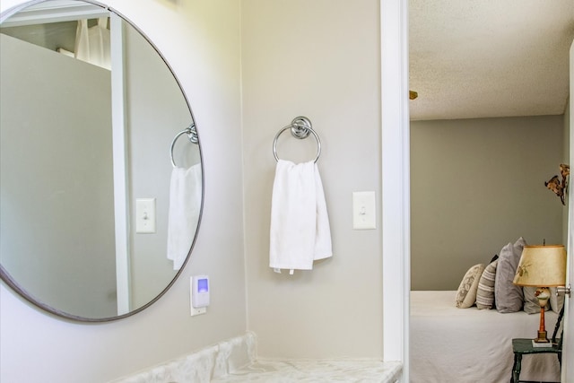 bathroom featuring a textured ceiling