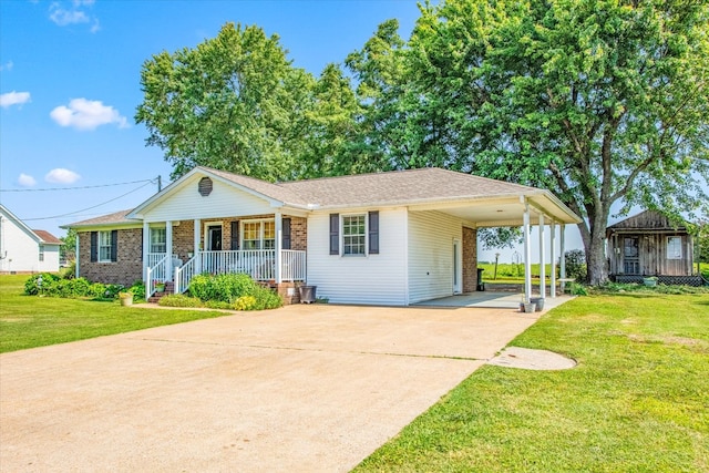 view of front of house with a front yard, a porch, and a carport