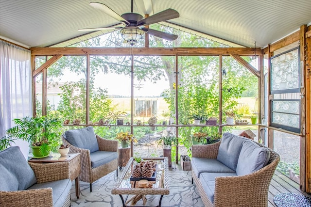 sunroom / solarium featuring ceiling fan and lofted ceiling