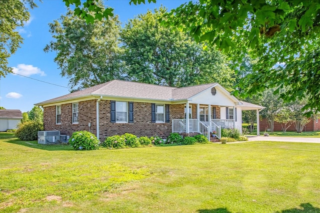 single story home featuring a front yard, central AC unit, and covered porch