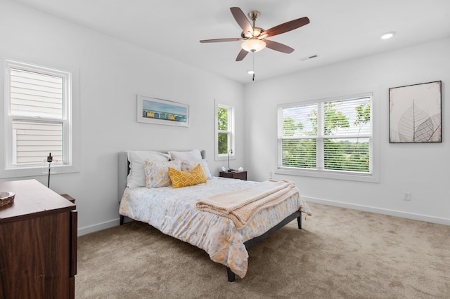 bedroom with ceiling fan and carpet floors