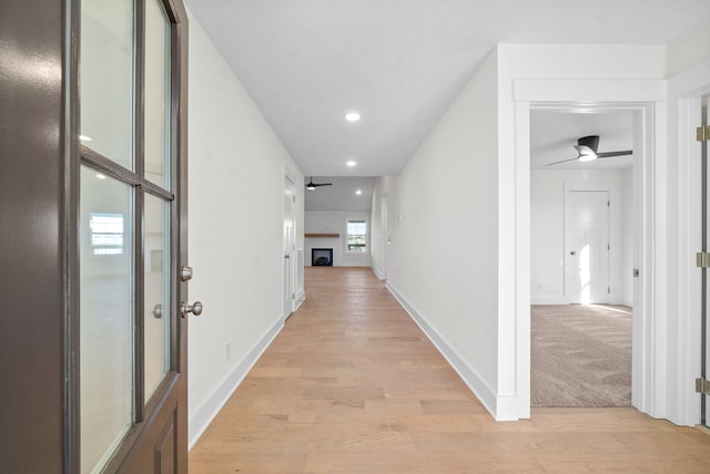 hallway featuring light wood-type flooring