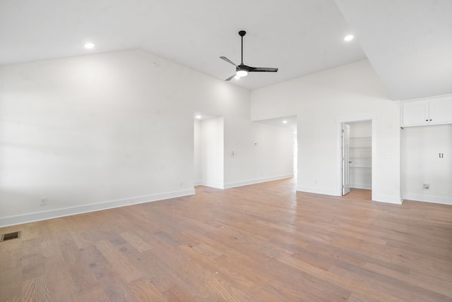 interior space featuring high vaulted ceiling, ceiling fan, and light wood-type flooring