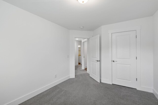 unfurnished bedroom with carpet flooring