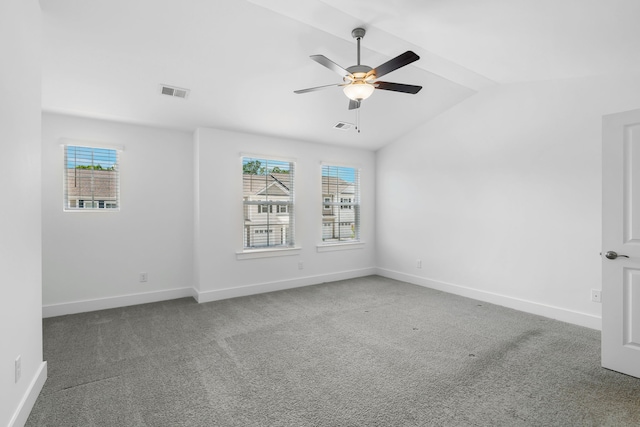 unfurnished room with ceiling fan, vaulted ceiling, and carpet flooring