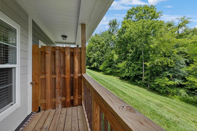 wooden terrace with a yard