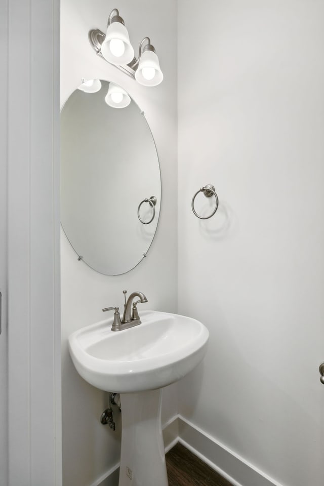 bathroom with hardwood / wood-style flooring