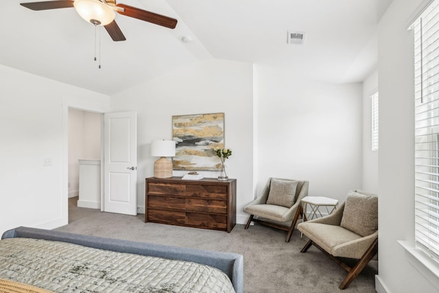 bedroom with ceiling fan, carpet flooring, and vaulted ceiling