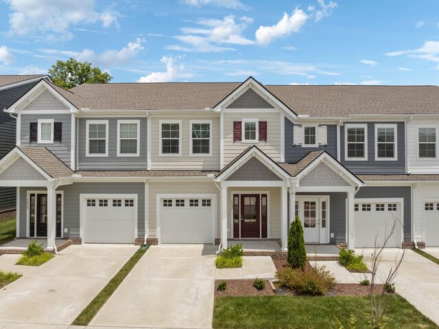 townhome / multi-family property featuring a garage