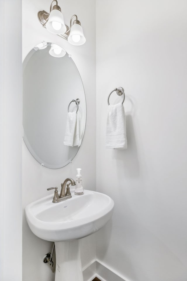 bathroom with an inviting chandelier