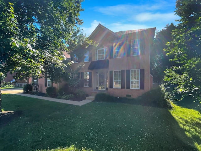 view of front facade featuring a front yard