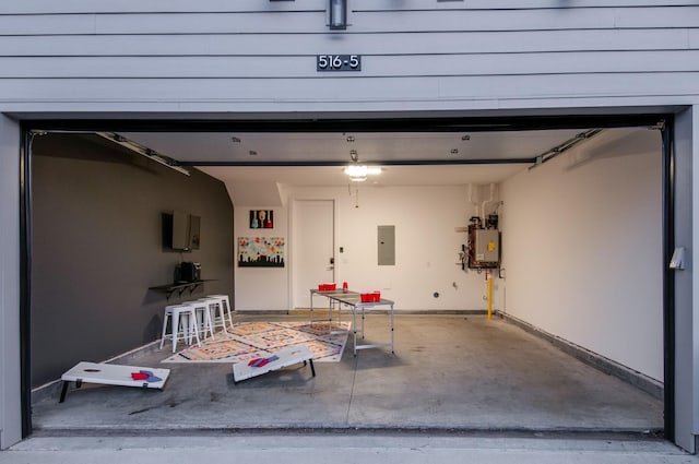 garage with electric panel and water heater