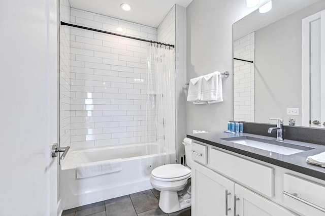 full bathroom with tile patterned floors, shower / bath combo with shower curtain, vanity, and toilet