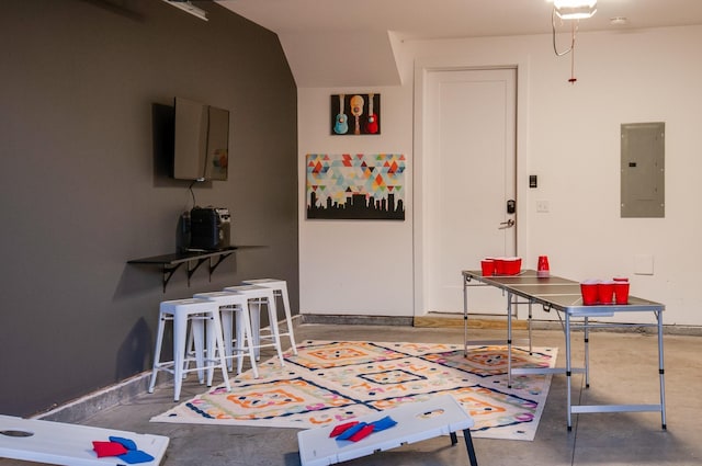 interior space with electric panel and concrete flooring