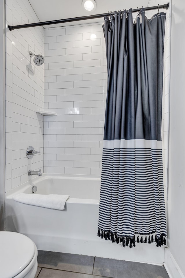 bathroom with shower / bath combination with curtain and toilet